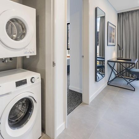 Meriton Suites Melburne Exterior foto Laundry facilities in a typical apartment