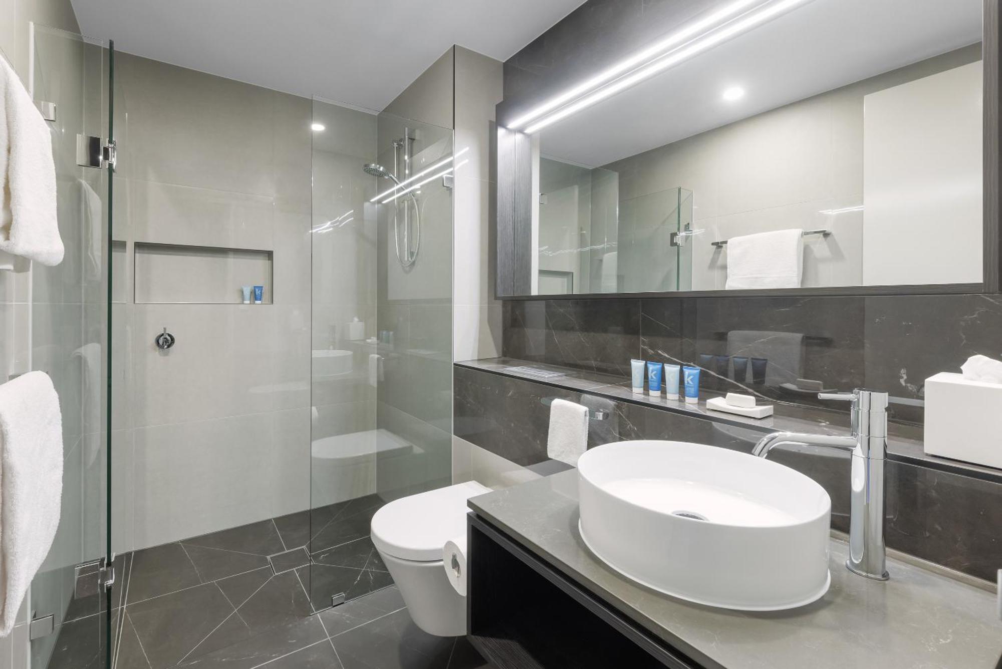 Meriton Suites Melburne Exterior foto A modern bathroom
