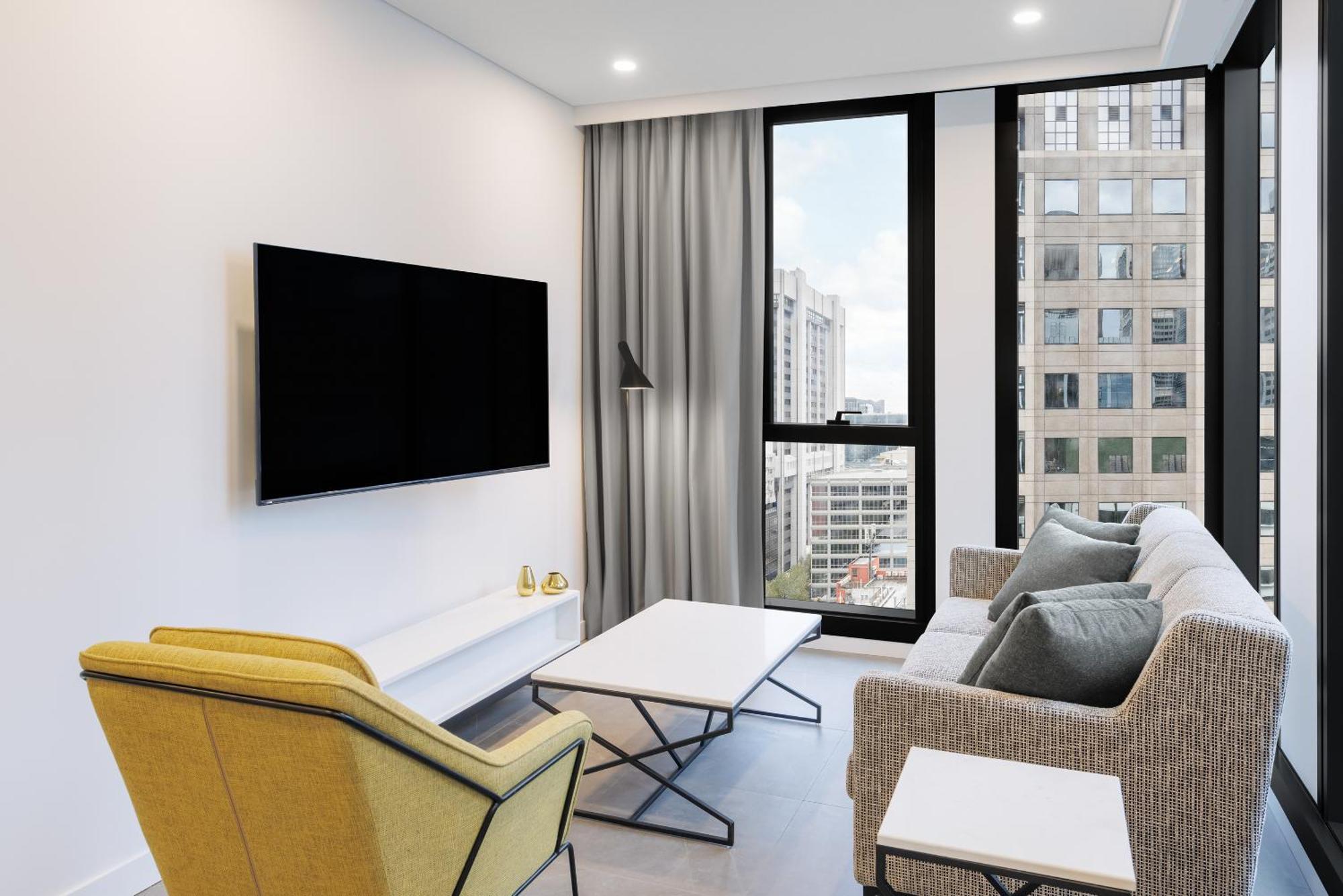 Meriton Suites Melburne Exterior foto A living room